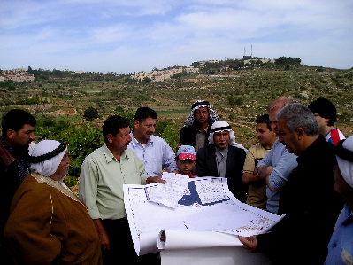 Villagers showing maps and deeds